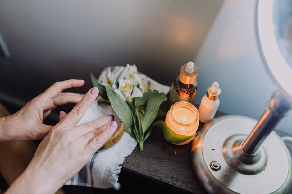 Relaxing skincare scene with hands, candles, and natural products for a soothing experience
